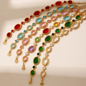 Detailed close-up of 18k gold plated bracelets featuring colorful faceted Czech crystals