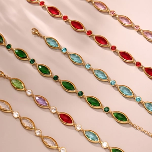 Detailed macro view of 18k gold plated anklets with vibrant faceted colorful glass stones