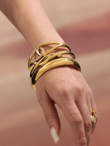 Detail of 18k gold plated multi-layer wrap bracelet with micro-pave crystal accents