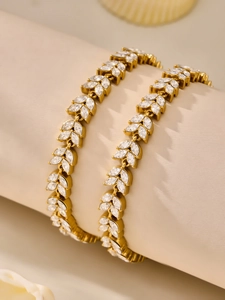 Macro shot of 18k gold plated wheat motif bracelets with sparkling 5A zircon stones