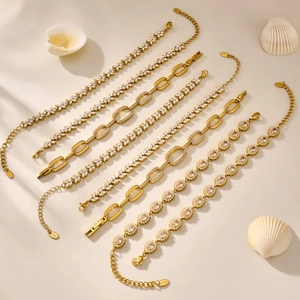 Gold stainless steel bracelet set featuring clover designs and 5A cubic zirconia stones
