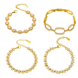 Set of four gold stainless steel bracelets with clear cubic zirconia in diverse designs
