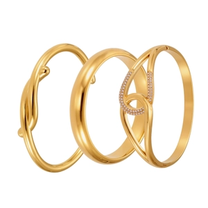 Three-piece set of 18k gold plated bracelets featuring twisted, polished, and paved designs