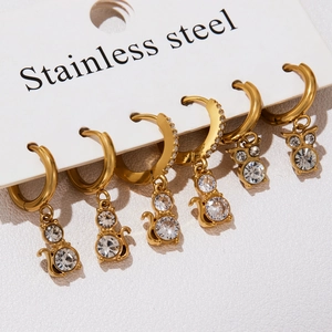 Three pairs of gold stainless steel cat earrings with clear cubic zirconia stones