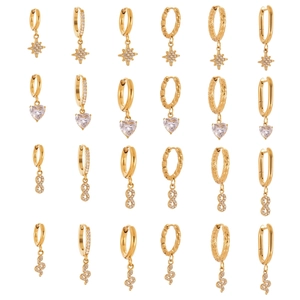 Set of 24 gold plated huggie earrings featuring star and heart crystal charms