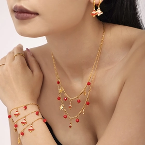Christmas tree jewelry set with red enamel charms and gold finish necklace and bracelet