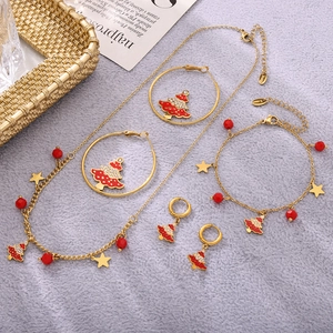 Golden stainless steel Christmas tree jewelry set with red beads and star pendants