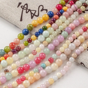 Close-up of polished 4-12mm natural stone round beads for DIY jewelry making