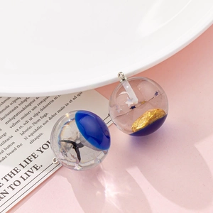 Resin sphere pendants featuring blue sky, whale tail, and starry sky motifs with silver loops