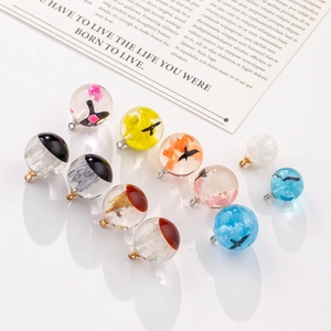 Detailed view of colorful resin sphere pendants with cloud and floral patterns inside