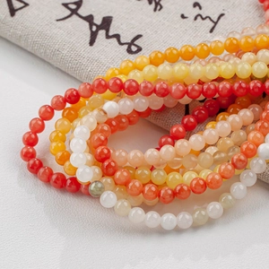 Polished natural jade beads in warm yellow and red tones for DIY handmade jewelry