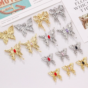 Macro view of various butterfly jewelry pendants with rhinestones for DIY crafting