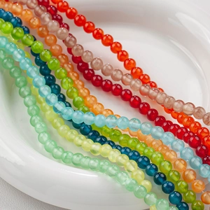 Detailed view of polished colorful round ice silk jade beads for DIY jewelry making