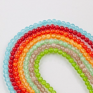 Macro shot of colorful 6-8mm natural ice silk jade round beads for DIY jewelry making