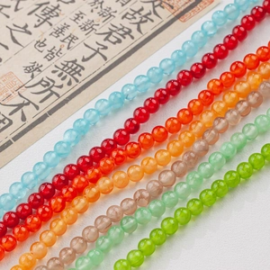 Macro detail of assorted colorful 4-12mm smooth ice silk jade round beads for DIY jewelry