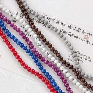 Natural jade colored round beads in dark tones for DIY handmade jewelry and necklaces