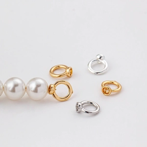 Detail of 18k gold closed loop clasp connector for DIY pearl necklace and bracelet jewelry