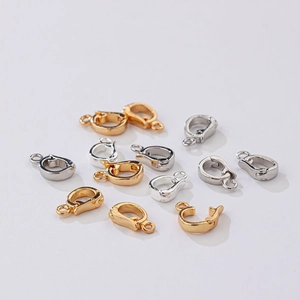 Close-up of gold and silver plated DIY jewelry lobster clasps and connectors