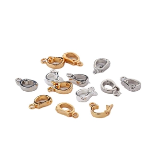 Polished gold and silver spring clasps for DIY jewelry making on white background