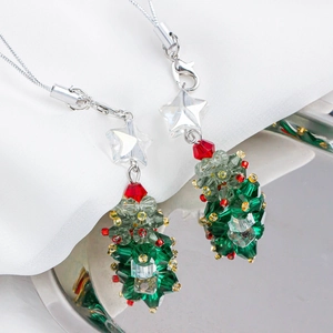 Macro shot of faceted crystal Christmas tree charms with red and green holiday beads