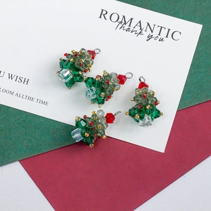 Macro shot of 4-piece set crystal Christmas tree pendants for DIY jewelry making