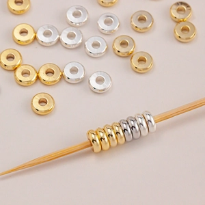 Macro view of 14K gold plated flat spacer beads for DIY jewelry making and bracelets