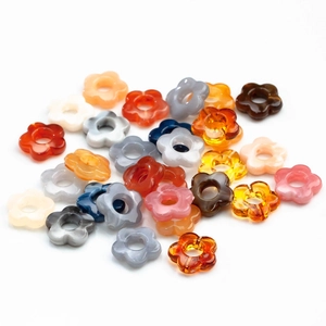 Macro shot of 14mm acrylic flower beads with marble texture for DIY jewelry making