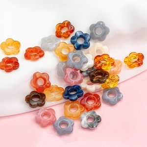 Macro shot of colorful 14mm acrylic flower beads for DIY handmade jewelry crafts
