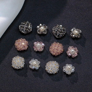 Detailed view of handmade crystal flower beads with center pearls and faceted stones