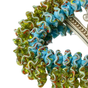 Exquisite blau-grüne Lampwork-Glasperlen mit künstlerischem Wellenrand-Design