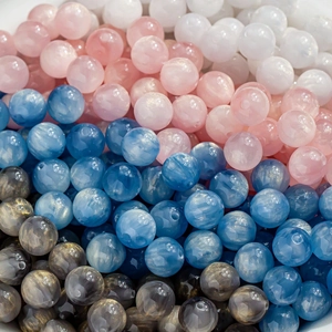 Macro shot of colorful marbled resin beads with glitter for DIY jewelry making
