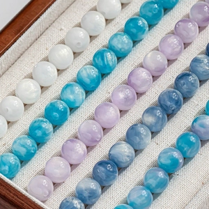 Mélange de perles œil de chat 8mm et 10mm pour bijoux DIY aux tons bleus et blancs galaxie