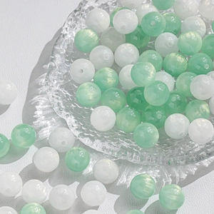 Polished mint green and cream white glass beads with gold glitter for DIY jewelry making