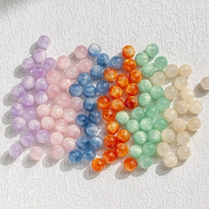 Close-up of assorted 8-10mm macaron cat eye beads for DIY jewelry making projects