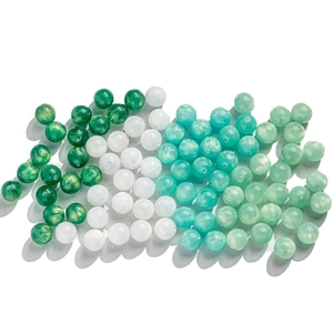 Mix of green and white cat eye beads with marble texture for DIY jewelry making