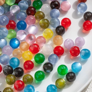 Macro shot of 10mm colorful cat eye resin beads for DIY jewelry making and crafts