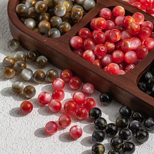 Polished 10mm resin beads in red, grey, and black colors for DIY jewelry making