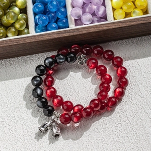 Rainbow cat eye resin bead bracelets with silver flower spacers and bell charms