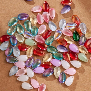 Macro detail of colorful gradient teardrop glass petals for DIY handmade hair accessories
