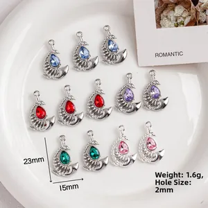 Alloy moon pendants with colorful rhinestones set in a white ceramic dish, 23mm x 15mm