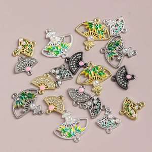 Macro view of Chinese style alloy fan charms with bamboo leaf patterns and pearls