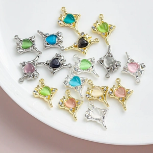 Macro view of colorful starburst heart charms with rhinestones for DIY jewelry making
