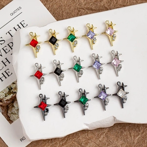 Macro shot of assorted colorful four-pointed star charms with zircon and metal plating