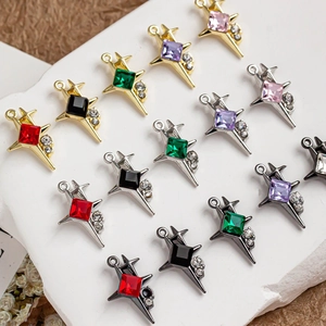 Macro view of four-pointed star pendants with colorful crystals for DIY jewelry making