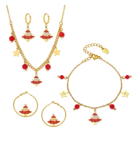 Detail of gold stainless steel Christmas tree jewelry set with red enamel and crystals