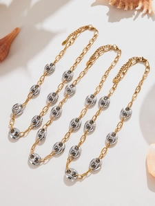 Detailed view of dual-tone stainless steel pig nose chain necklaces with lobster clasp