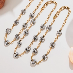 Two-tone stainless steel mixed chain necklace with gold and silver links on seashell decor