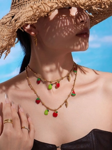Double-layer gold beaded necklace featuring colorful strawberry and watermelon fruit charms