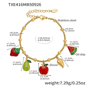 Detailed view of fruit charm bracelet with strawberry and avocado pendants and size specs