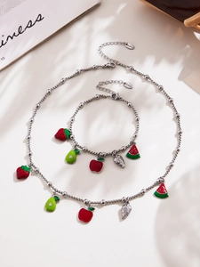 Detail of stainless steel jewelry set with colorful fruit charms and zircon accents